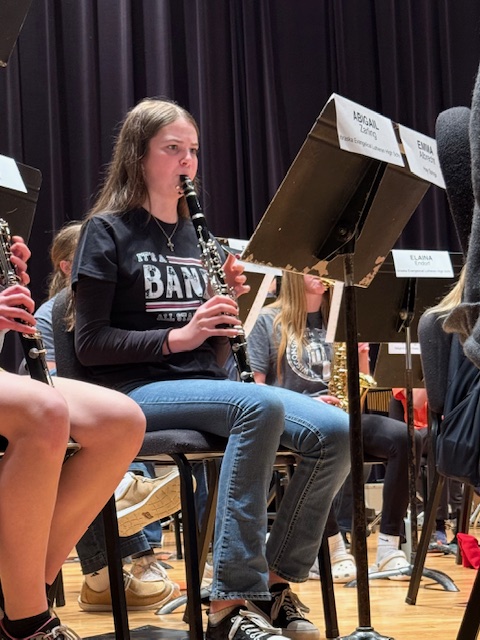 All state band student playing clarinet.