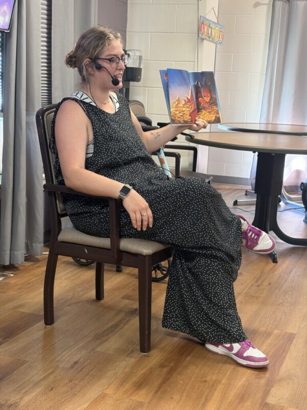 Mrs. Toof reading a book