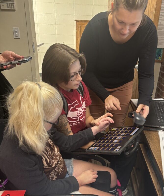 Student using AAC to recite the Pledge of Allegiance Student using AAC to recite the Pledge of Allegiance