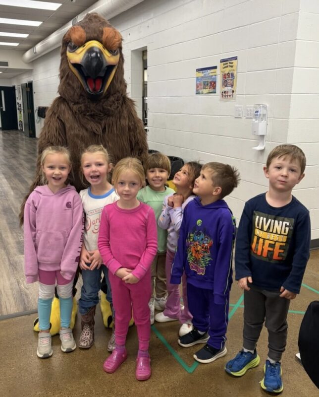 New Hawk mascot with students